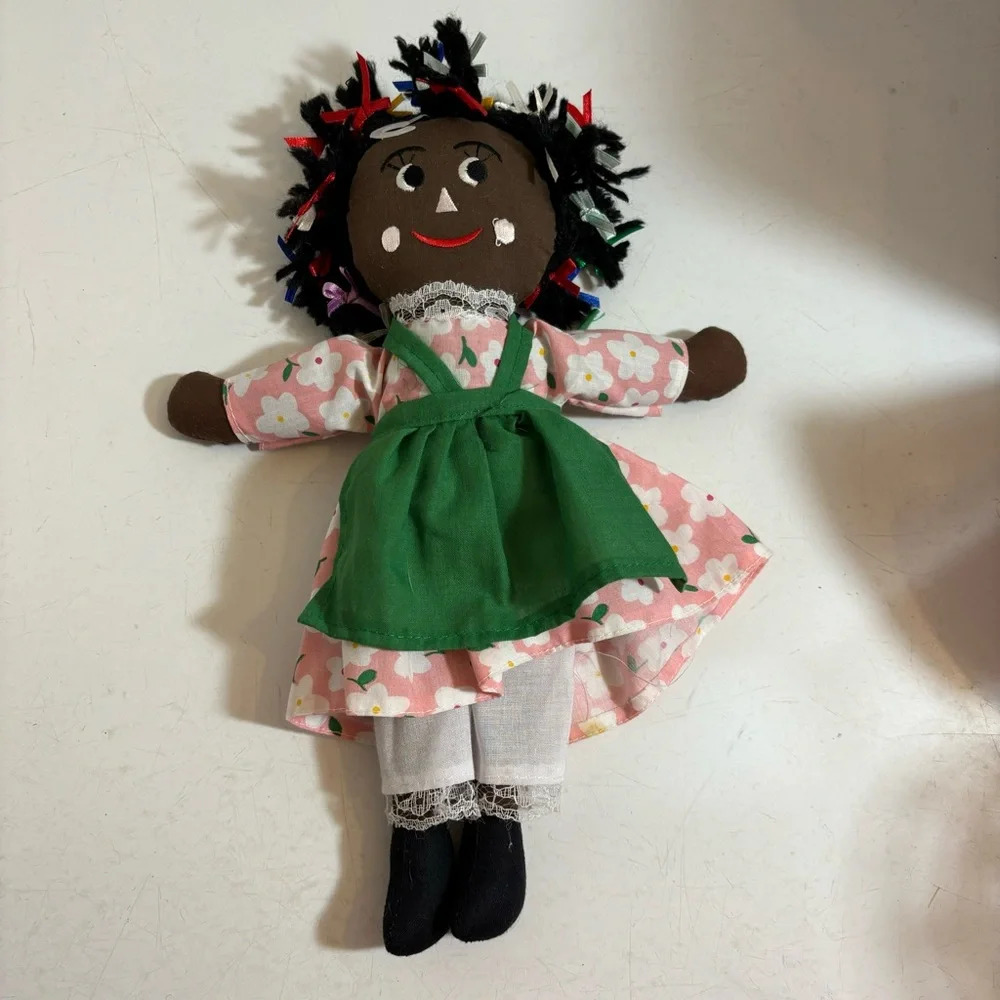 New with tags 11 inch Rasta stuffed doll with dress and apron